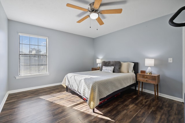 bedroom featuring ceiling fan and dark hardwood / wood-style flooring