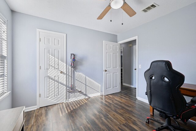 office with ceiling fan and dark wood-type flooring