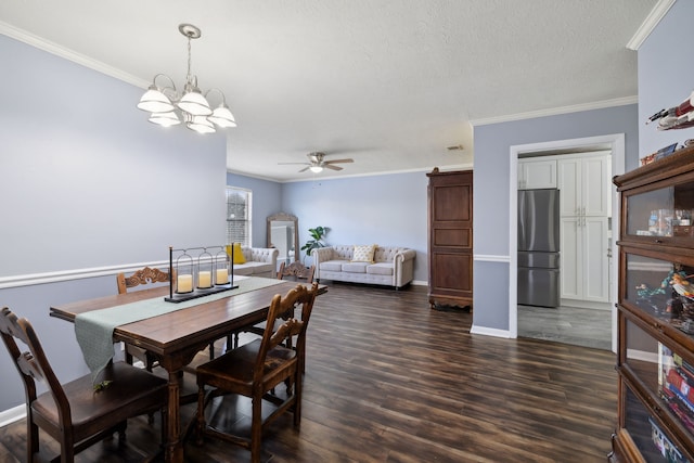 dining area featuring a textured ceiling, crown molding, dark wood-type flooring, and ceiling fan with notable chandelier