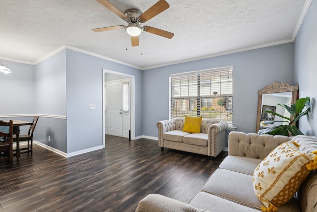 living room featuring ceiling fan, dark hardwood / wood-style flooring, a textured ceiling, and ornamental molding