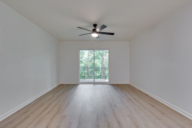 spare room with light wood-type flooring and ceiling fan