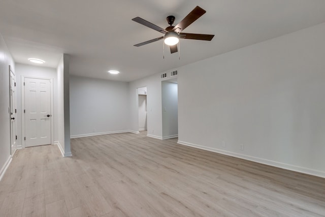 spare room with light wood-type flooring and ceiling fan