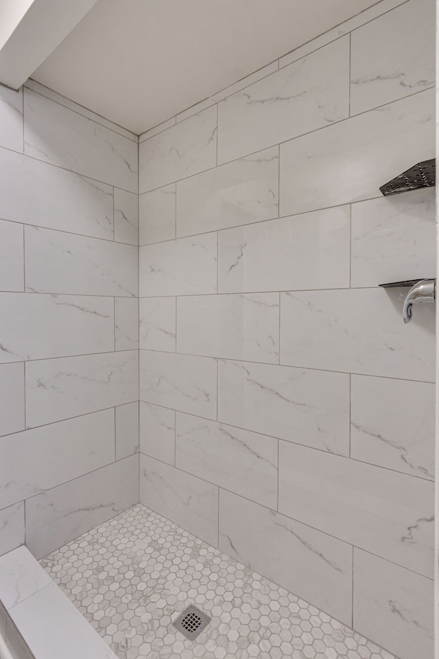 bathroom with tiled shower