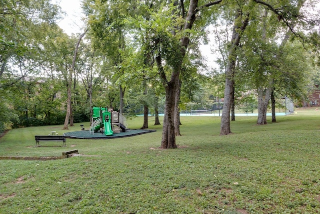 exterior space with a water view and a lawn