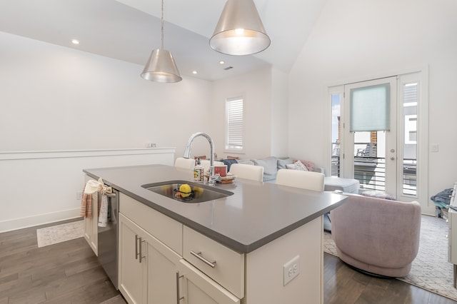 kitchen with pendant lighting, sink, a wealth of natural light, and vaulted ceiling