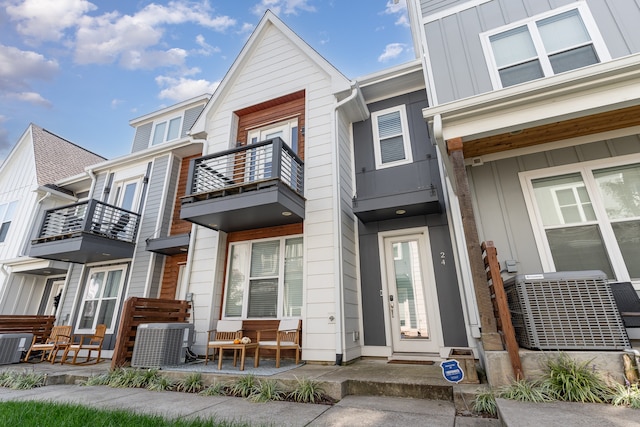 exterior space with a balcony and central air condition unit