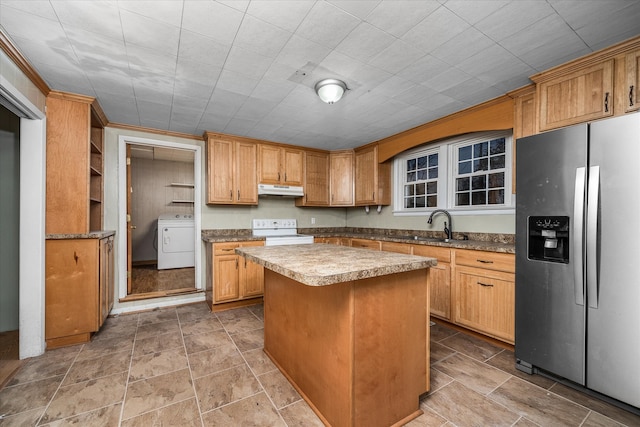 kitchen featuring electric stove, sink, stainless steel refrigerator with ice dispenser, a kitchen island, and washer / clothes dryer