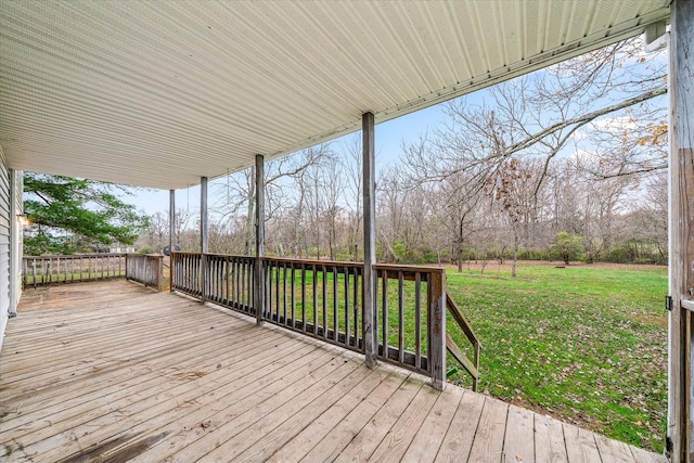 wooden terrace with a yard