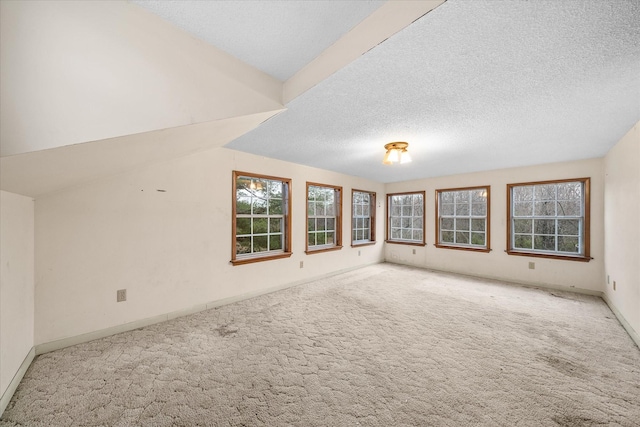 2269 Bowman Loop, Crossville, TN 38571 - carpeted empty room with a textured ceiling, baseboards, and vaulted ceiling