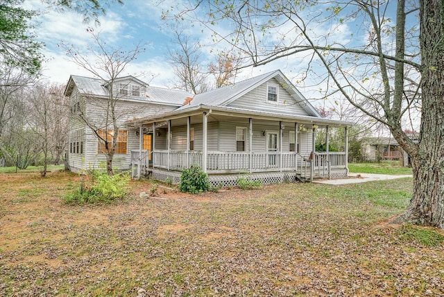 2269 Bowman Loop, Crossville, TN 38571 - farmhouse with a porch and metal roof