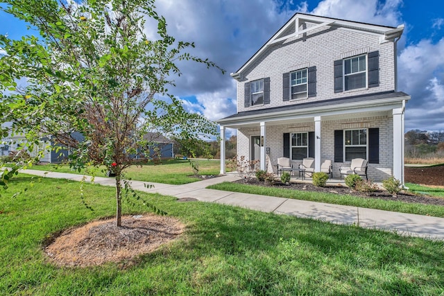 view of front facade featuring a porch and a front lawn