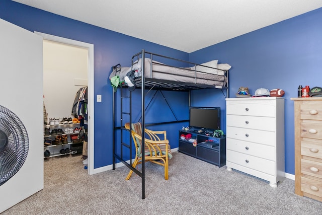 carpeted bedroom featuring a closet