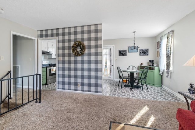 carpeted dining area with a chandelier and a healthy amount of sunlight