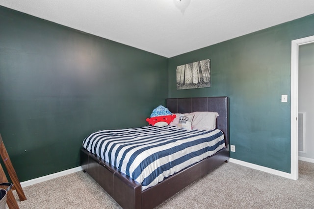 bedroom with light colored carpet