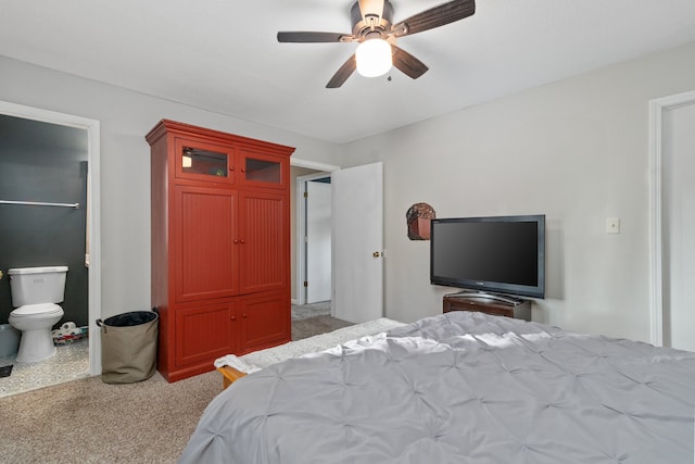 carpeted bedroom featuring ceiling fan and connected bathroom