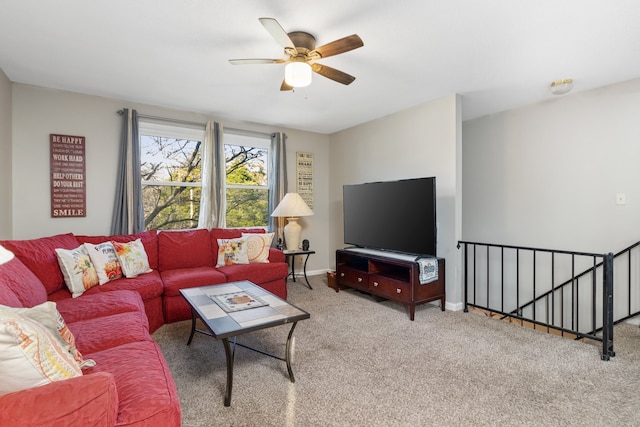 living room featuring carpet and ceiling fan