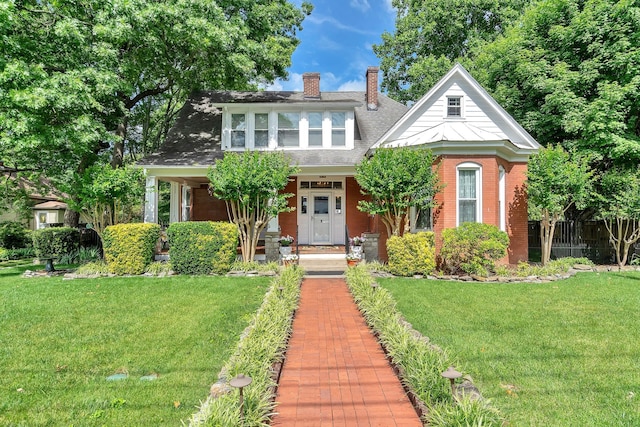 view of front of house featuring a front yard and covered porch