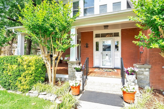 property entrance with covered porch