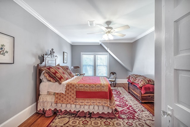 bedroom with hardwood / wood-style floors, ceiling fan, and crown molding