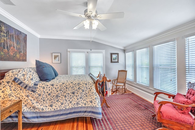 bedroom with crown molding, multiple windows, lofted ceiling, and ceiling fan