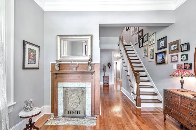 interior space with wood-type flooring and ornamental molding