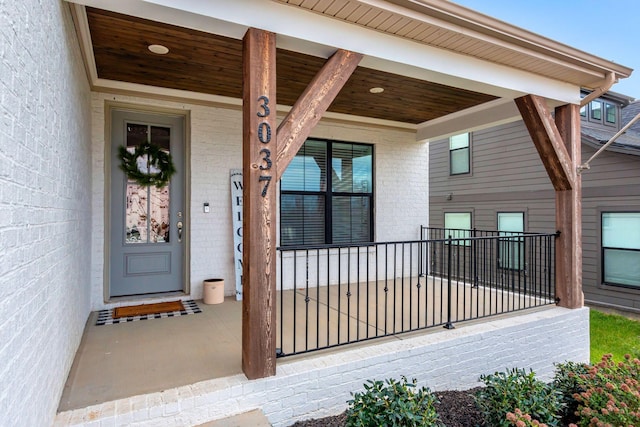 doorway to property with covered porch