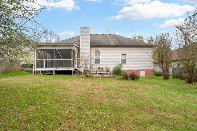 back of house with a sunroom and a yard