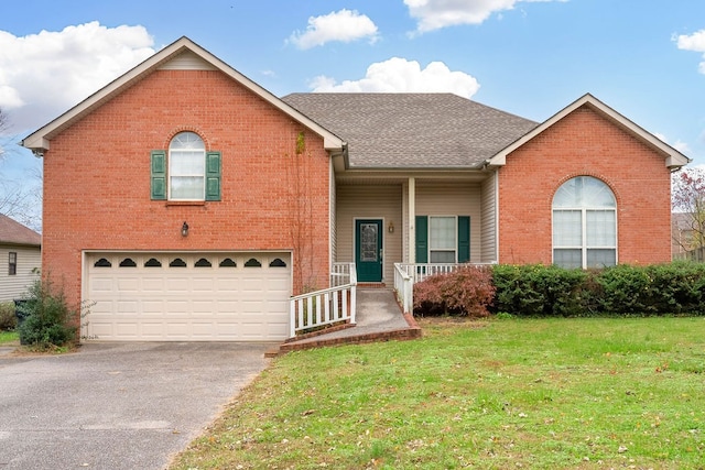 view of front of house with a front lawn, a porch, and a garage