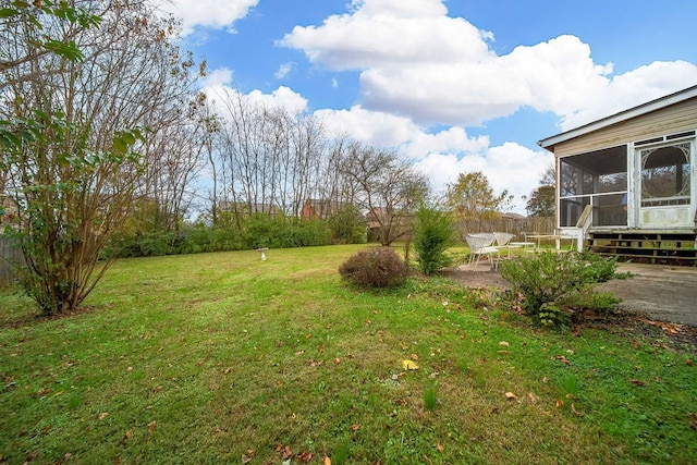 view of yard featuring a patio and a sunroom