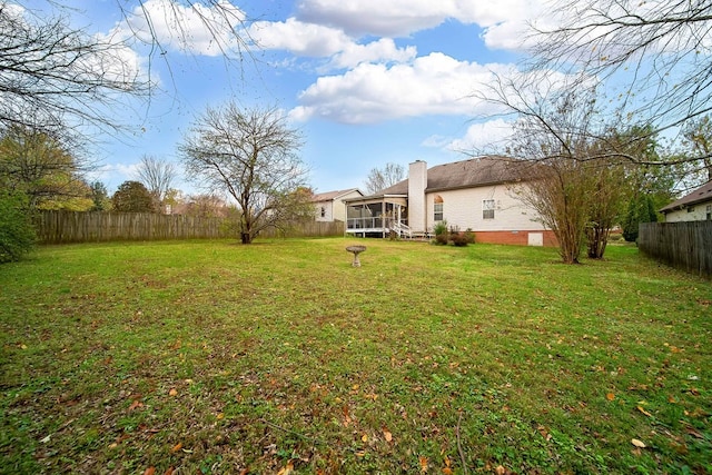 view of yard with a sunroom