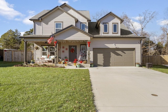 view of front of property featuring a garage, a porch, and a front yard