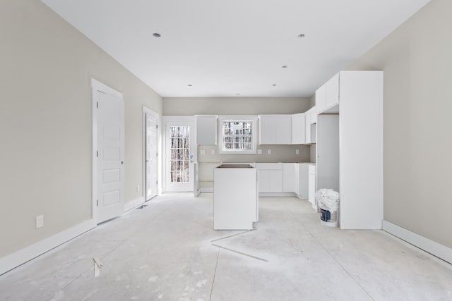 kitchen with white cabinetry and a kitchen island