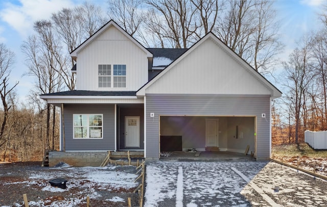 view of front of home featuring a garage and covered porch