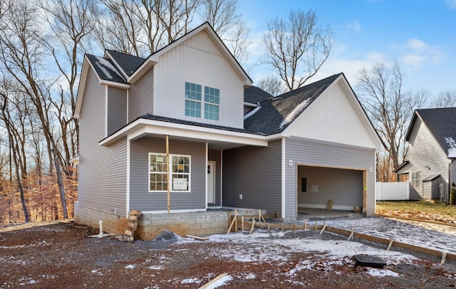 view of front of home featuring a garage and a porch