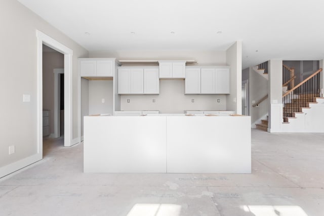 kitchen with a center island and white cabinets