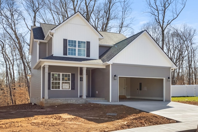 view of front of property featuring fence, a porch, roof with shingles, driveway, and an attached garage