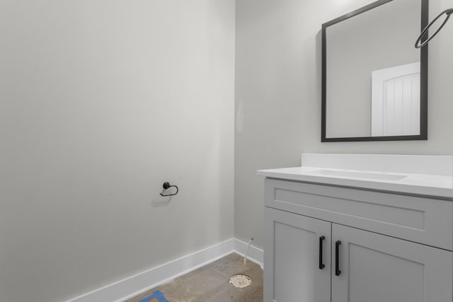 bathroom with vanity and baseboards