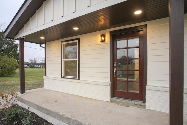 view of exterior entry featuring a porch