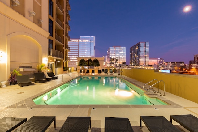 view of swimming pool with a patio