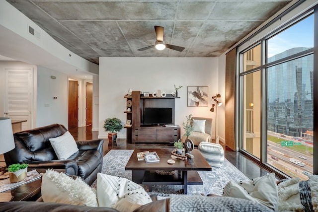 living room with hardwood / wood-style flooring and ceiling fan