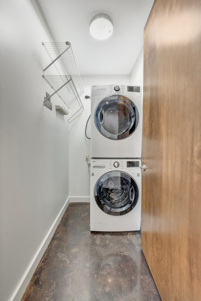 laundry room with stacked washer and dryer