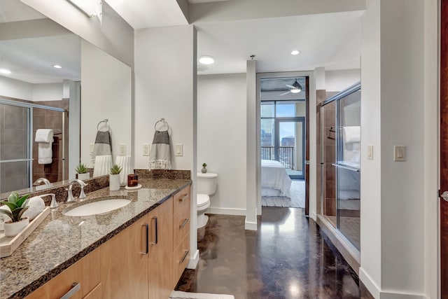 bathroom with concrete flooring, vanity, toilet, and walk in shower