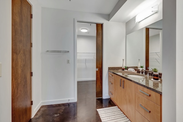 bathroom featuring vanity and concrete floors