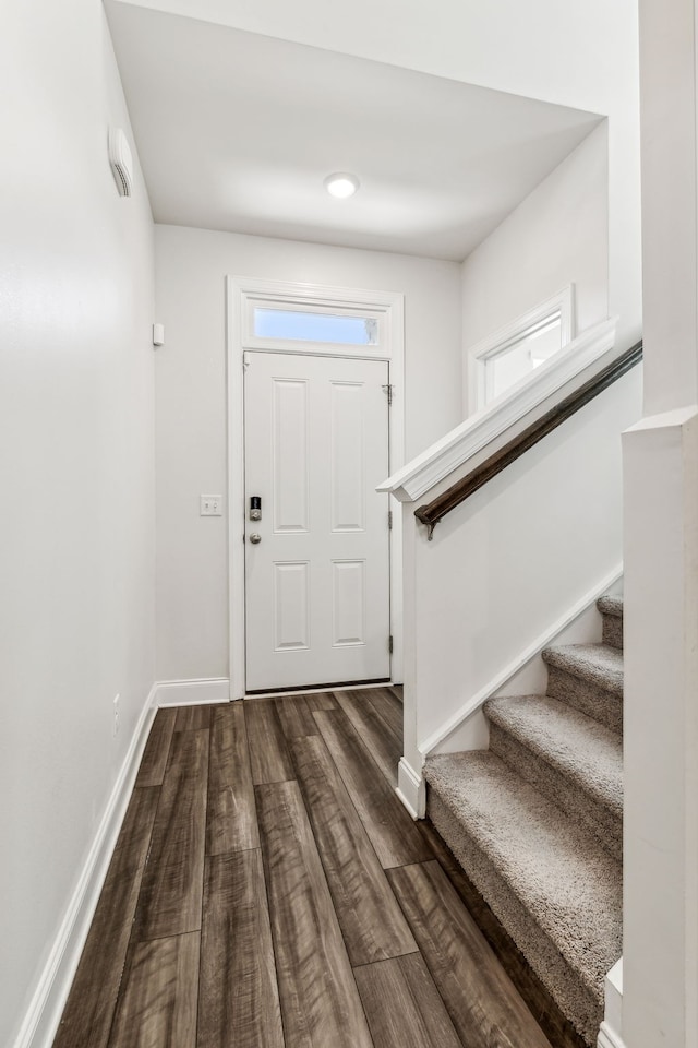 entrance foyer featuring dark wood-type flooring