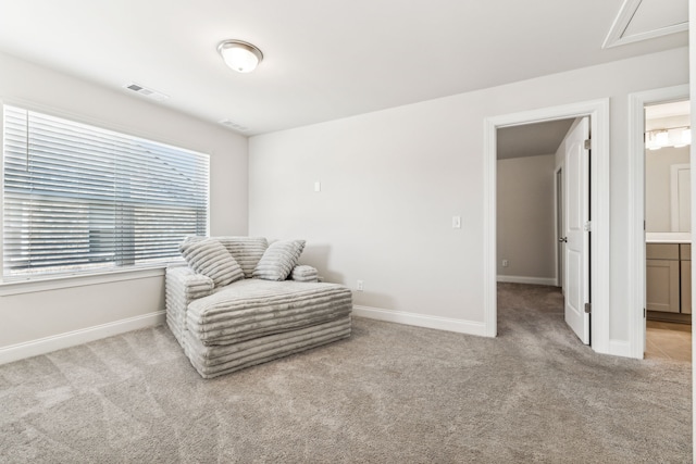 living area with light colored carpet