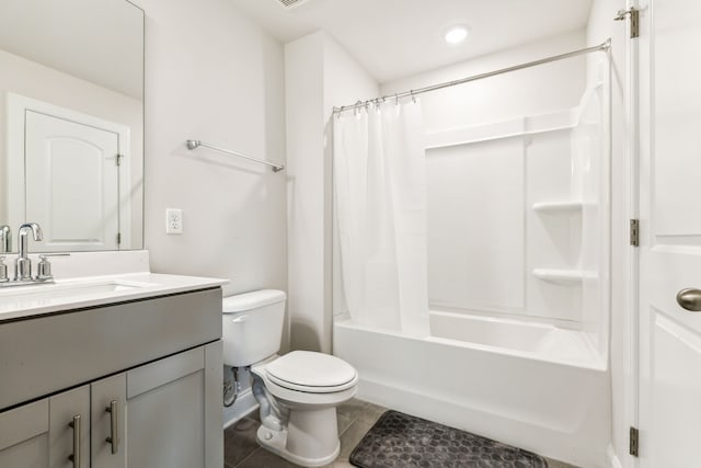 full bathroom with tile patterned floors, shower / bath combination with curtain, toilet, and vanity