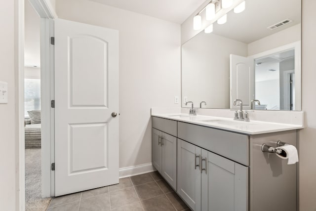 bathroom with vanity and tile patterned floors