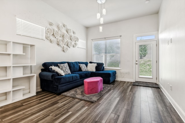 living room with dark hardwood / wood-style flooring