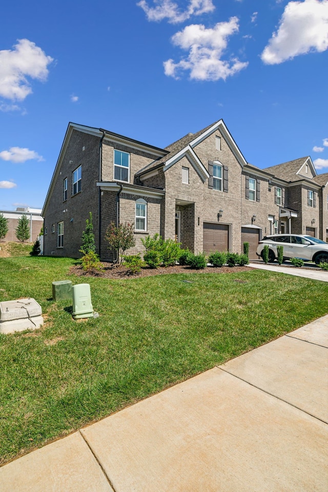 view of front of house featuring a front yard and a garage