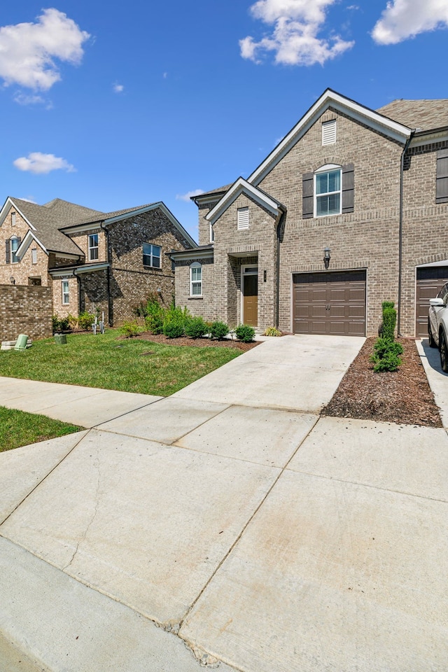 view of front facade featuring a garage and a front lawn